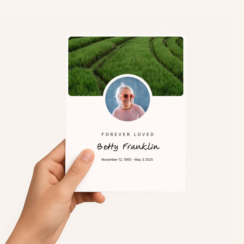 Hnad holding a piece of stationery